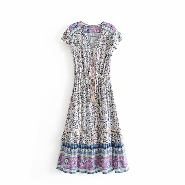 Nala Midi Dress from Shop The Kei - Full length front view of blue and purple floral boho midi dress with v neck, ruffle details, and flounce hem. Dress is shown against a plain white background